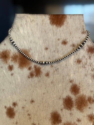 #053 Graduated Sterling Saucer Pearls : 18"
